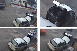 El sujeto retira la batería y trata de sustraer también la computadora del auto.
