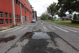 Lluvias empeoran baches