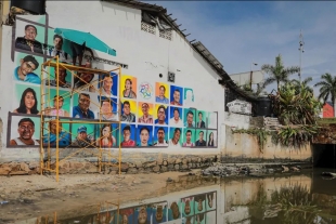 Pintan mural en Acapulco con rostro de desaparecidos