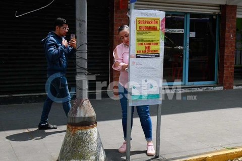 Suspensión simbólica por parte de vecinos de los parquímetros digitales