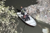 Buscan a joven que desapareció en canal de aguas negras al intentar rescatar un perrito