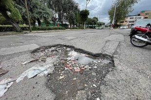 Lluvias agravan los baches